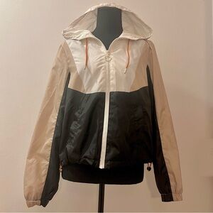 Black white and tan wind breaker